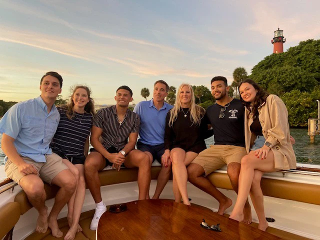 NASA Astronaut and Navy SEAL Chris Cassidy waving alongside Anatoly Ivanishin and Ivan Vagner while boarding the Soyuz MS-16 spacecraft at the Baikonur Cosmodrome in Kazakhstan.